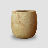 Vaso Campana Ovo Antique Delta com acabamento antique em tons terrosos, formato arredondado e orgânico.